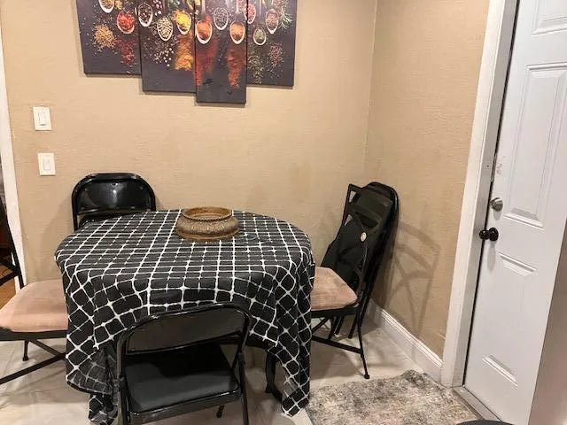 a bed sitting in a bedroom with a lamp