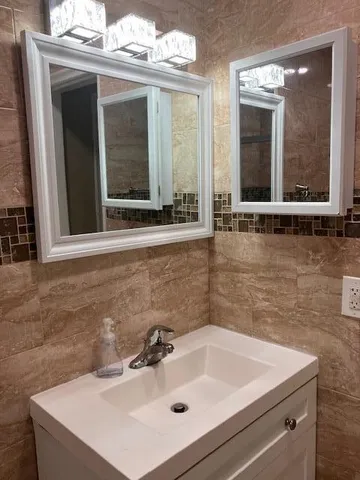 a white toilet sitting next to a shower