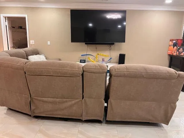 a living room with furniture and a flat screen tv