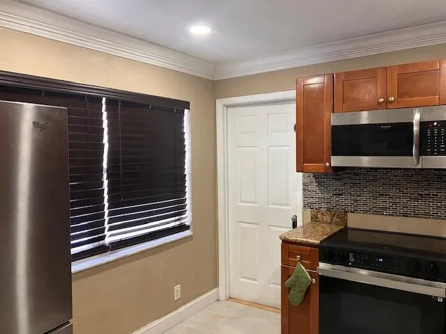 a bedroom with a chair and bed