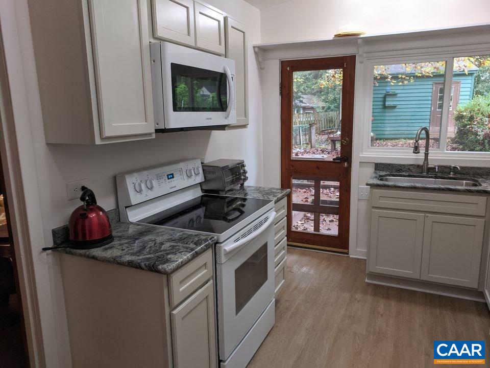 25 Stonefield Road Palmyra, VA 22963 - Photo 4 of 15 a kitchen with stainless steel appliances granite countertop a stove and a microwave