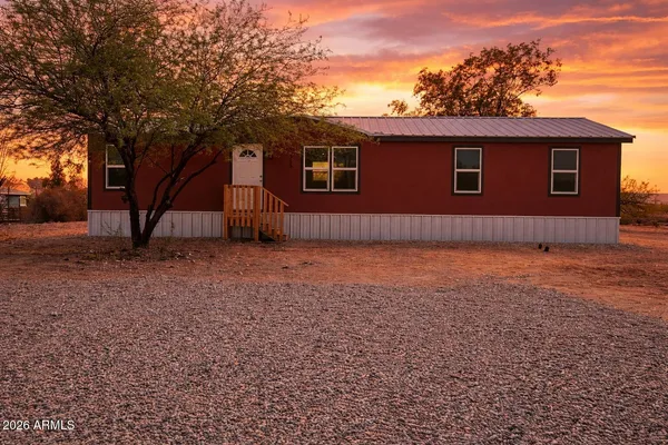 a house view with a backyard space