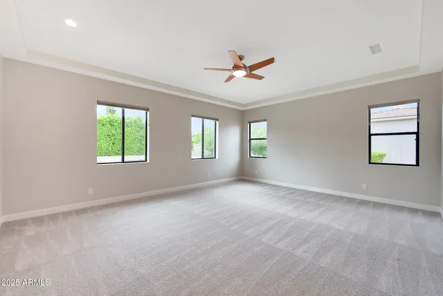 a view of a patio with a table and chairs