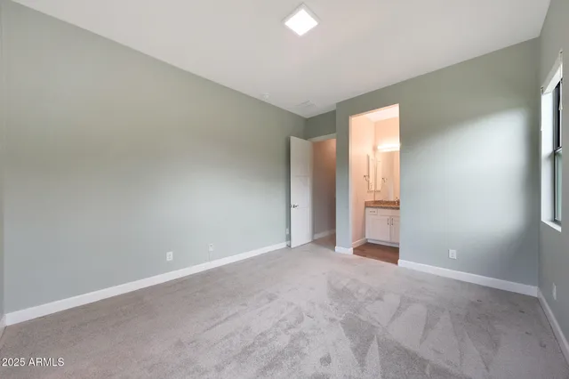 a view of backyard with seating area and trees