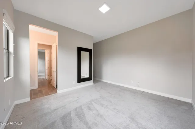 a view of a blue house with a yard