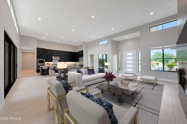 a spacious bathroom with a double vanity sink a mirror and a