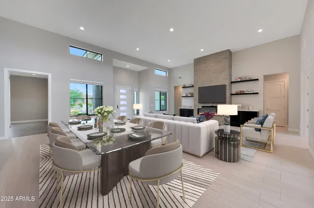 a spacious bathroom with a tub double sink and mirror