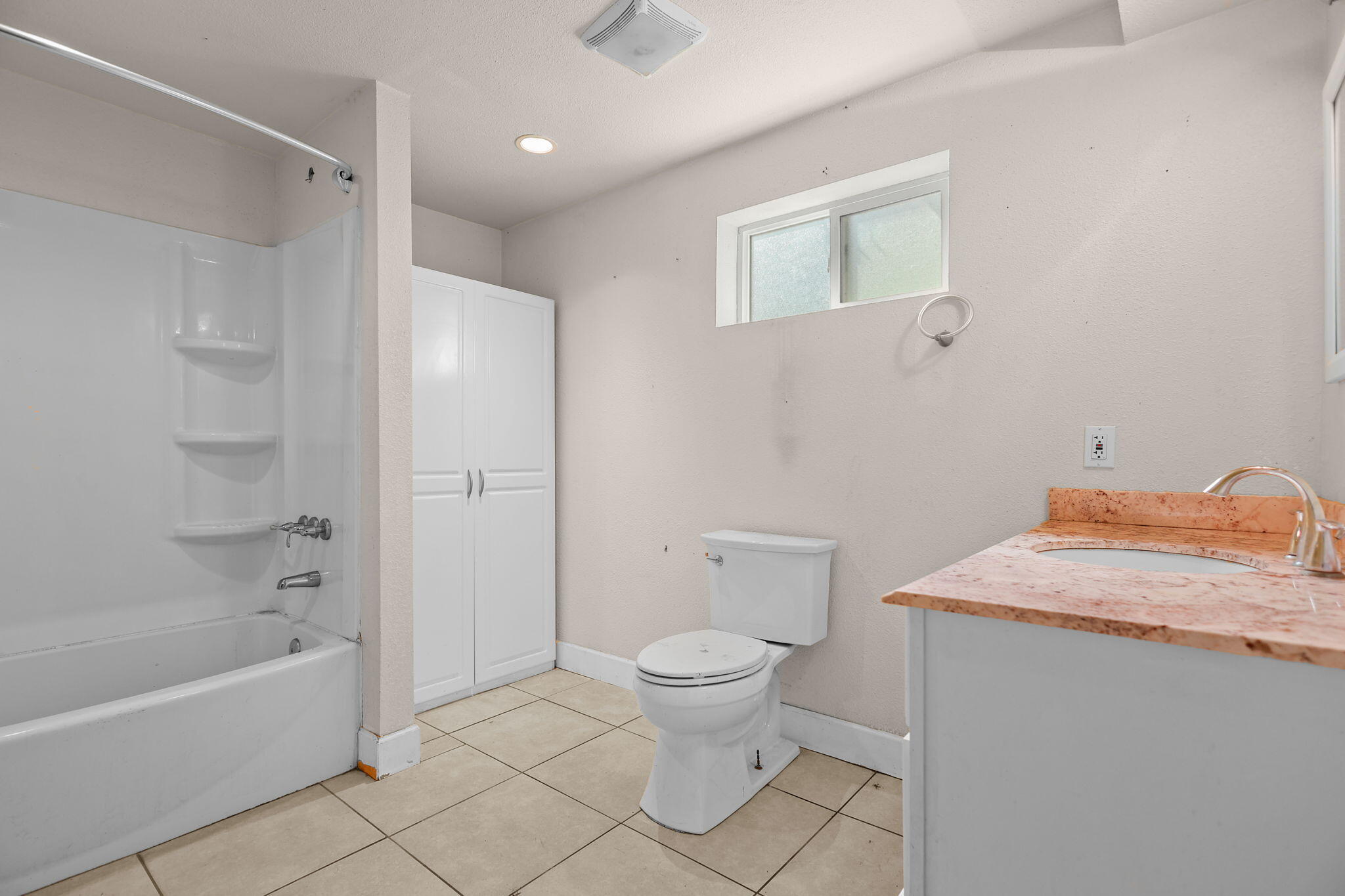 18855 Turnell Road Cottonwood, CA 96022 - Photo 15 of 34 a bathroom with a granite countertop sink toilet and shower