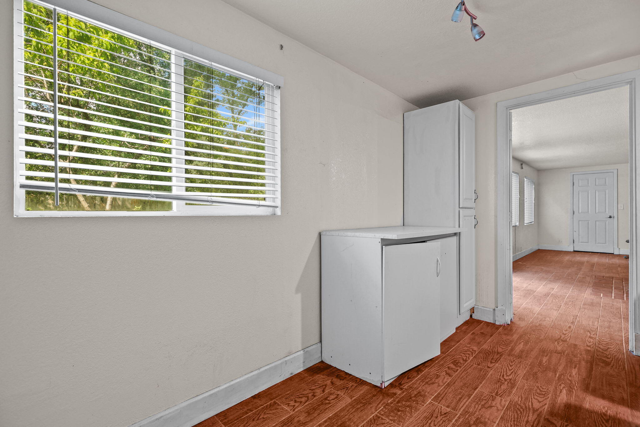 18855 Turnell Road Cottonwood, CA 96022 - Photo 20 of 34 a view of livingroom with hardwood floor and a window