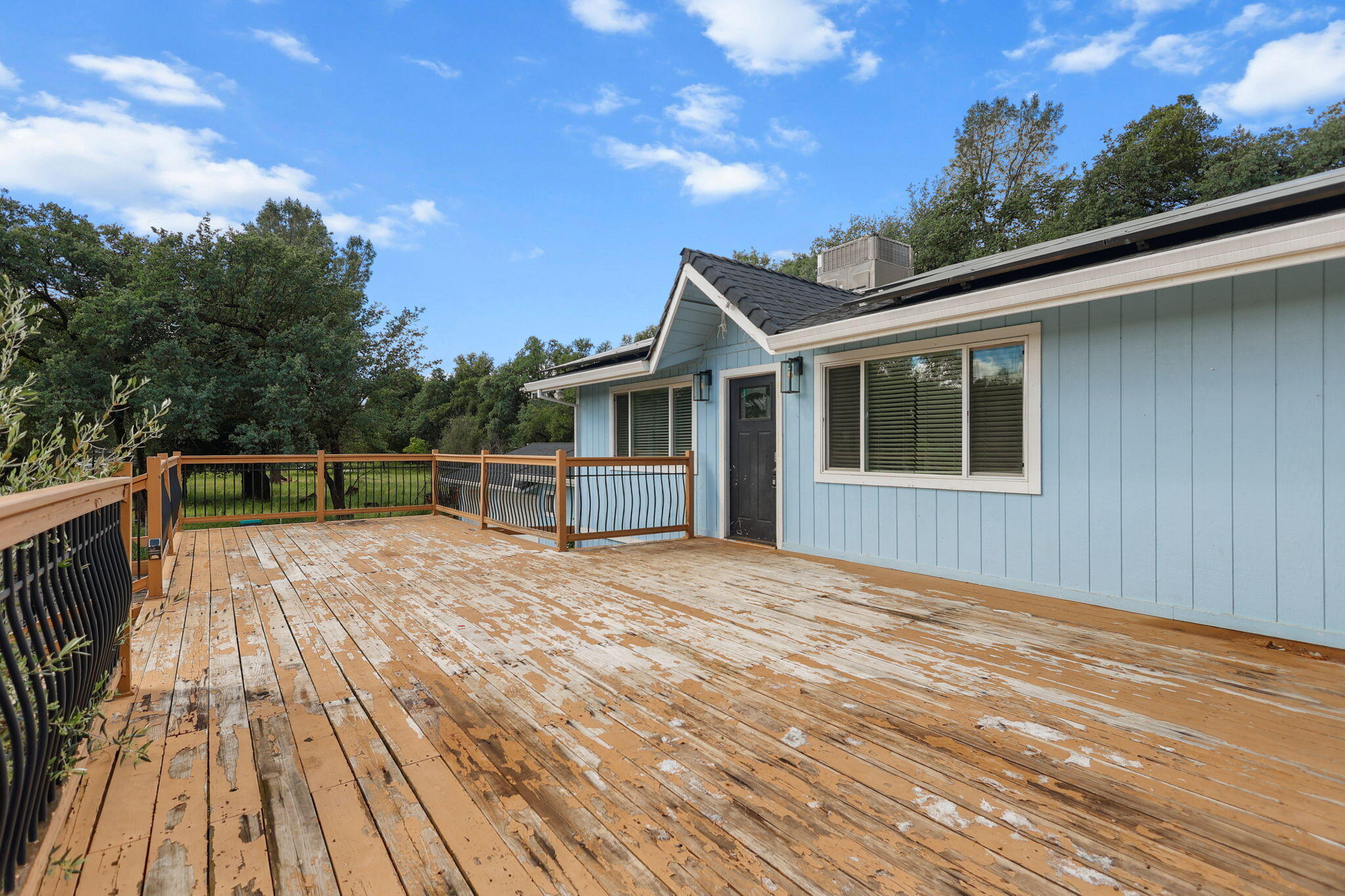 18855 Turnell Road Cottonwood, CA 96022 - Photo 23 of 34 a view of a house with wooden deck
