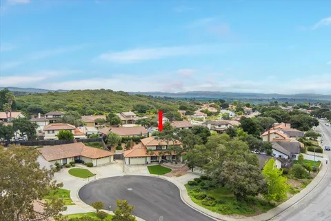 an aerial view of a house with outdoor space patio and swimming pool