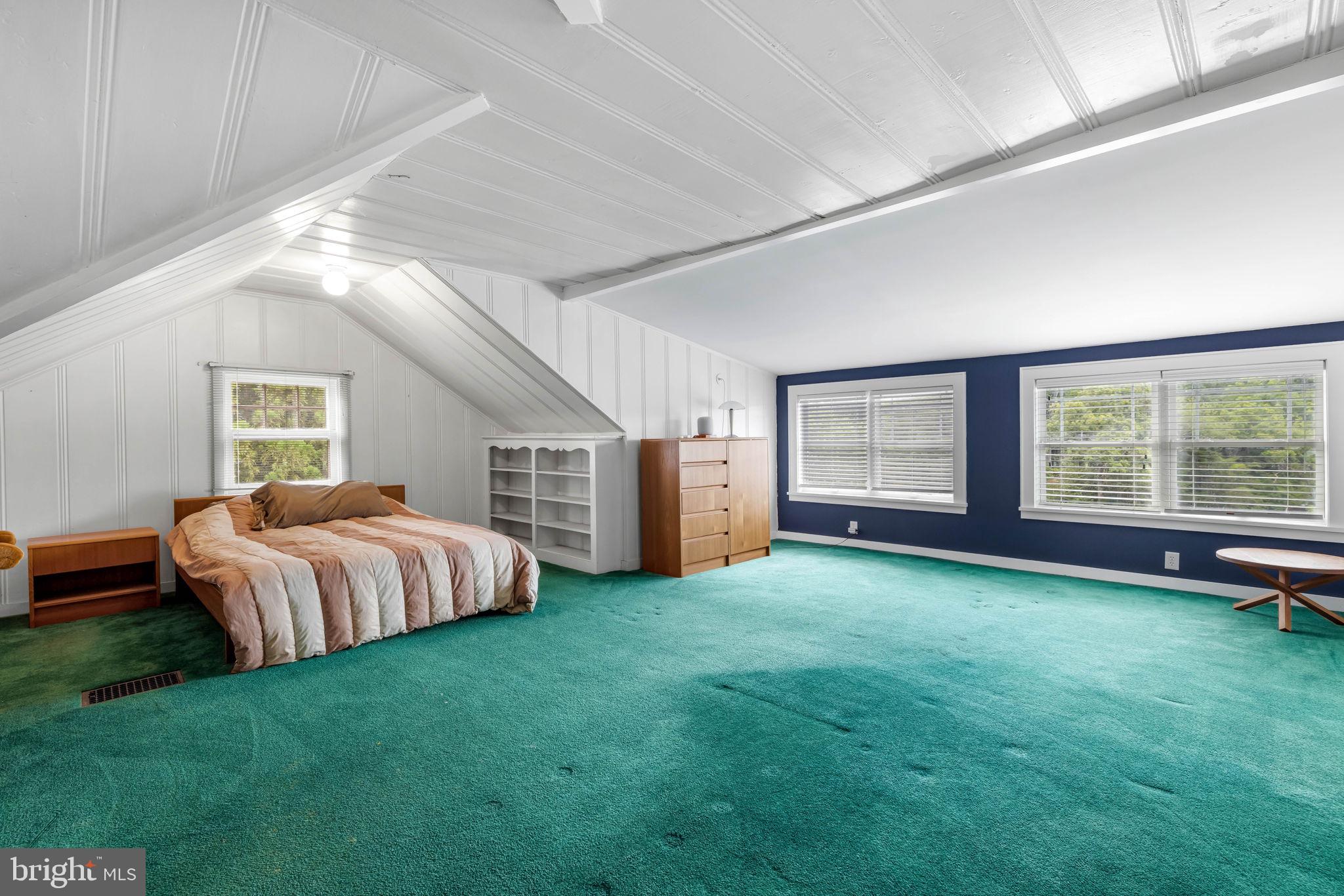 765 Dividing Road Severna Park, MD 21146 - Photo 12 of 17 a spacious bedroom with a bed and large window