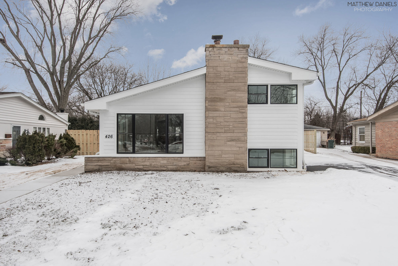 426 Shermer Road Glenview, IL 60025 - Photo 2 of 52 a view of a house with a snow in the yard