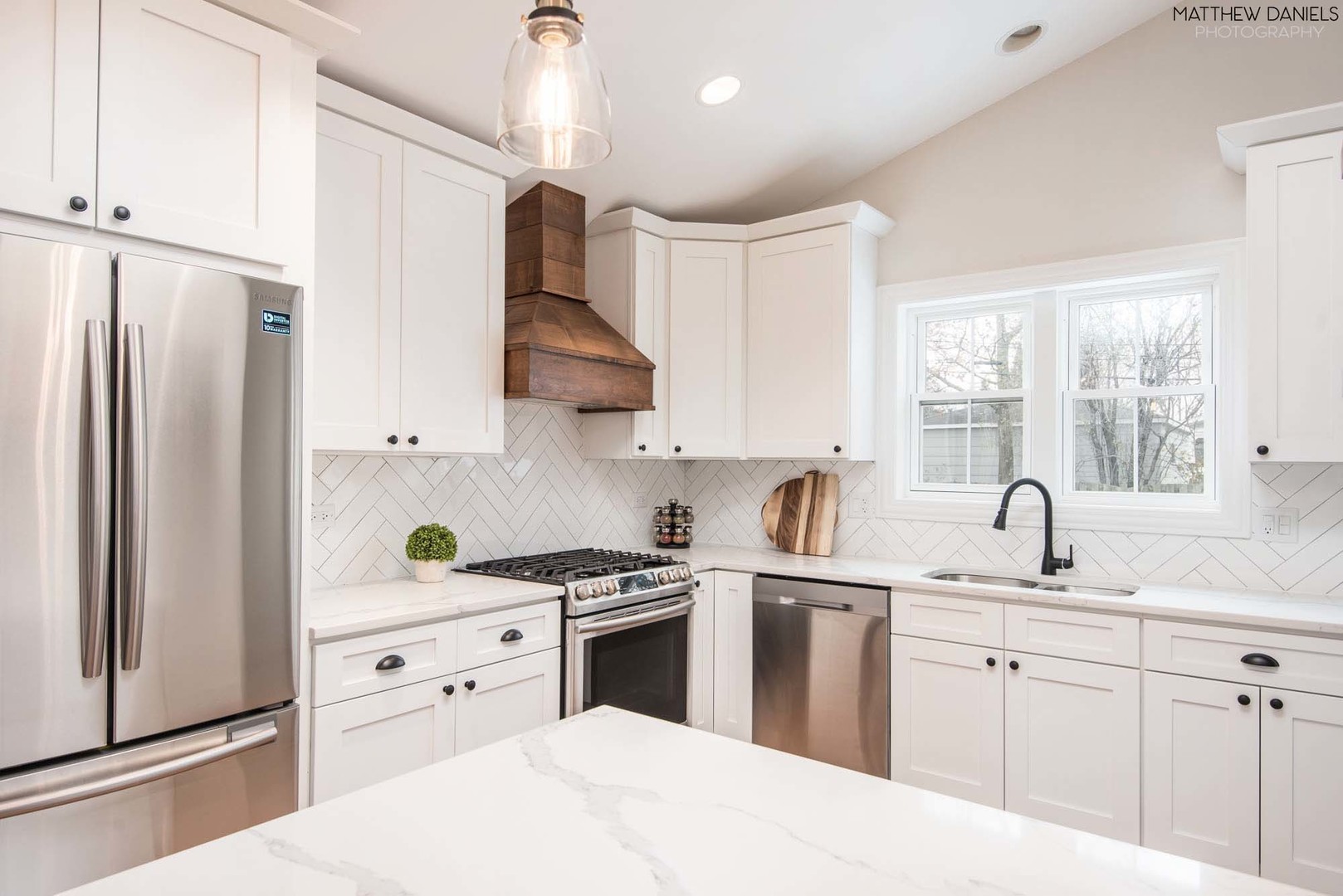 426 Shermer Road Glenview, IL 60025 - Photo 13 of 52 a kitchen with granite countertop a sink stainless steel appliances and window