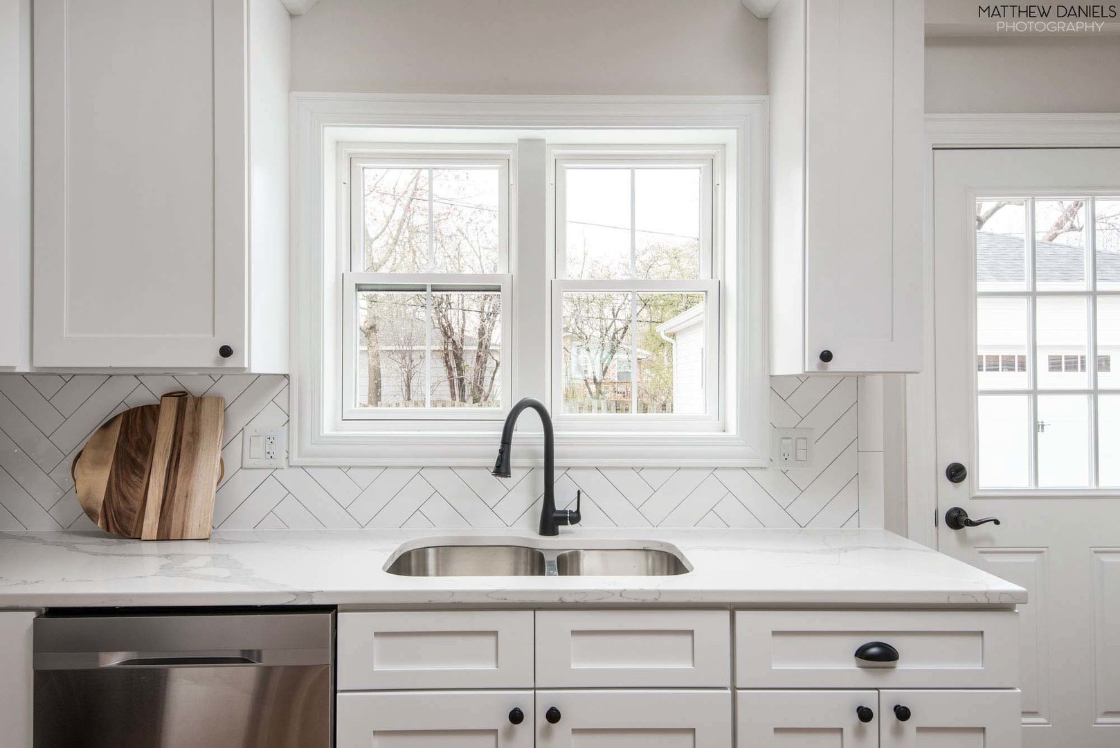 426 Shermer Road Glenview, IL 60025 - Photo 19 of 52 a kitchen with granite countertop a sink and a window