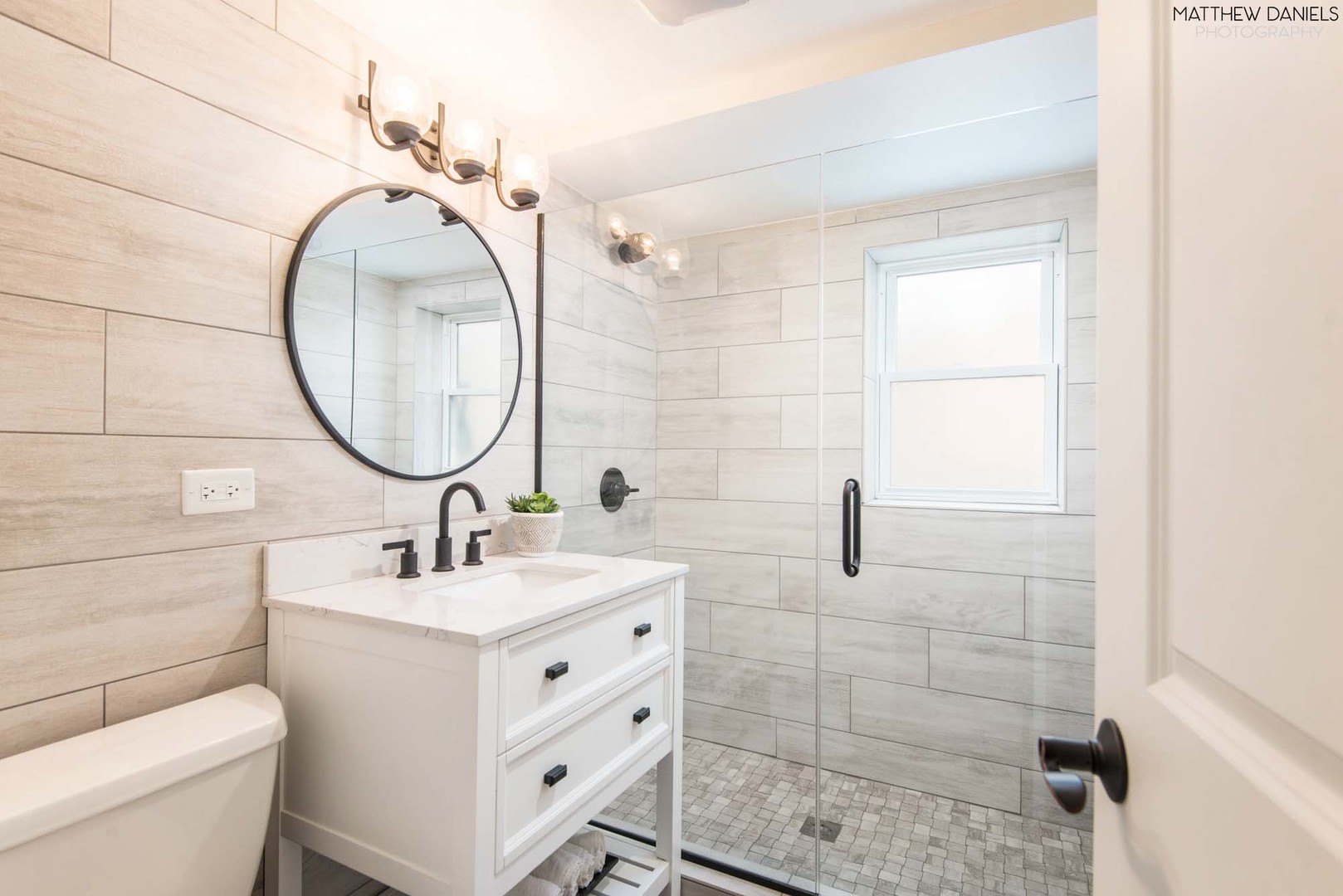 426 Shermer Road Glenview, IL 60025 - Photo 32 of 52 a bathroom with a sink a toilet and a mirror