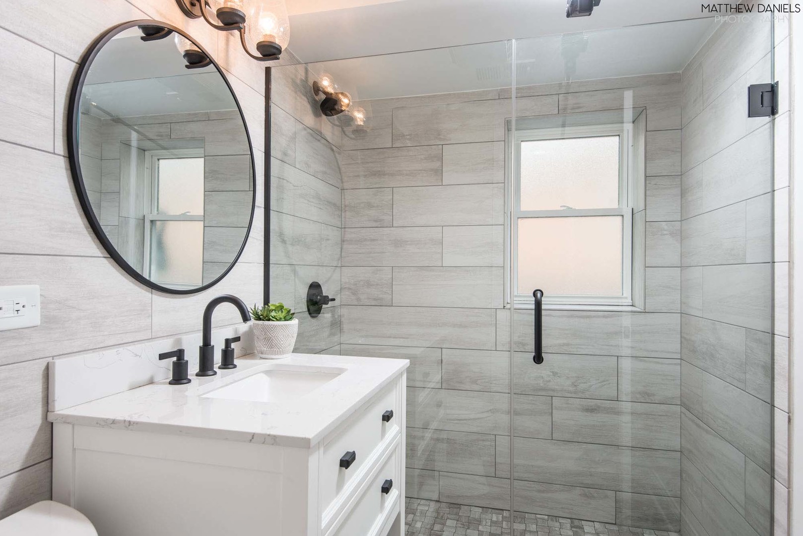 426 Shermer Road Glenview, IL 60025 - Photo 33 of 52 a bathroom with a sink a toilet and a mirror