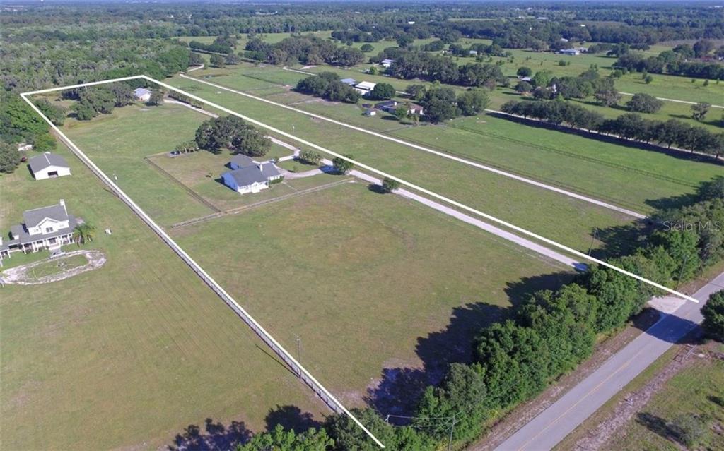 5807 Spencer Parrish Road Parrish, FL 34219 - Photo 1 of 1 an aerial view of a tennis court
