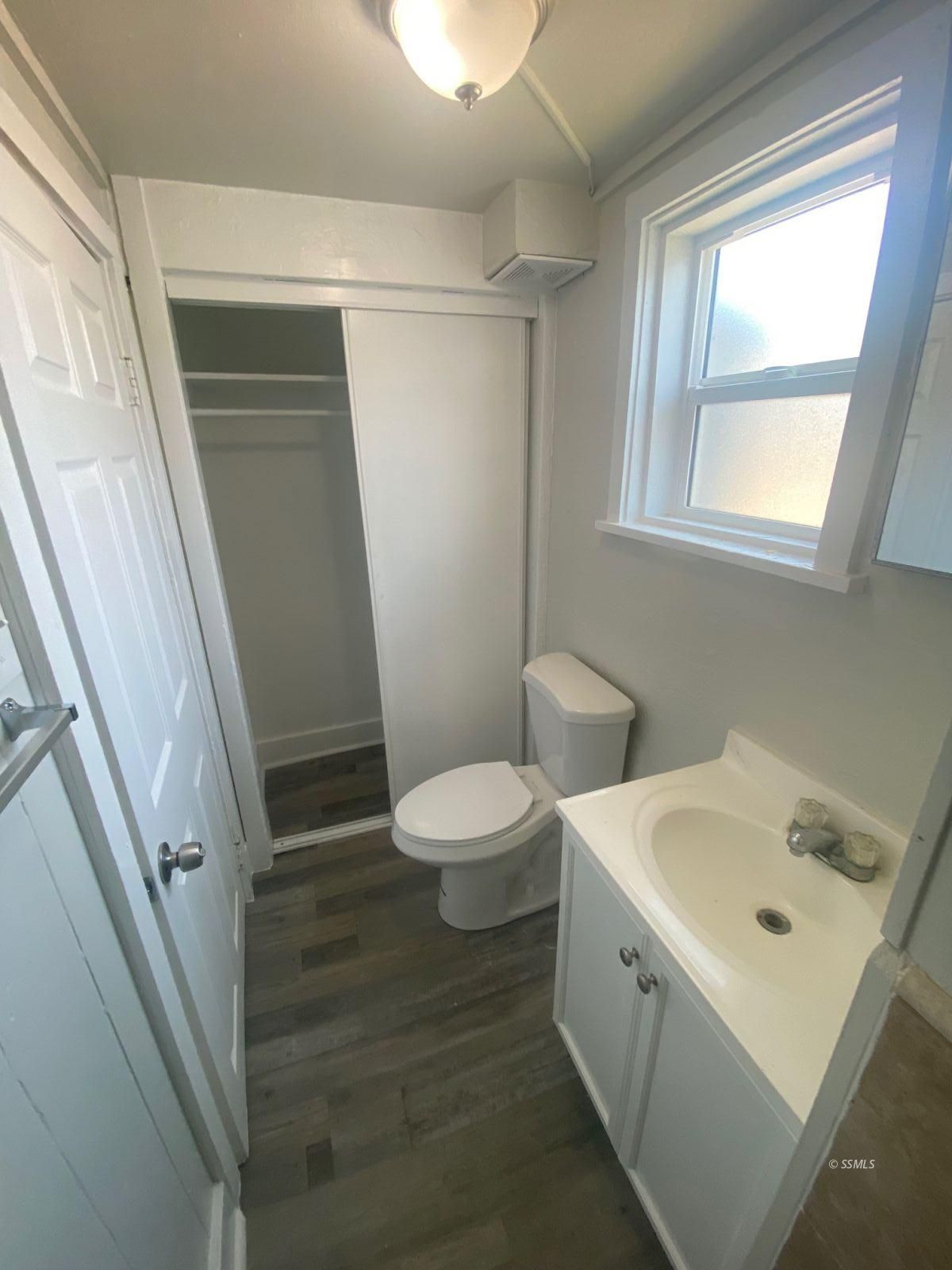 239 West Station Avenue Ridgecrest, CA 93555 - Photo 8 of 8 a bathroom with a toilet sink and a mirror