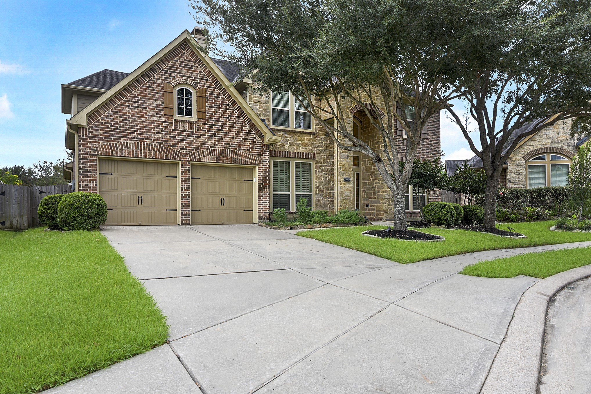 29023 Powder Ridge Drive Katy, TX 77494 - Photo 2 of 50 All-brick elevation with a long driveway leading up to the 3-car garage.