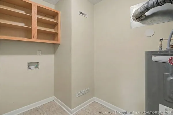 a view of storage and utility room with washer and dryer