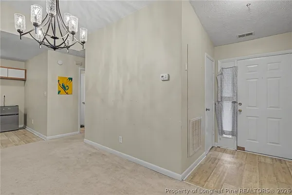 a view of an entryway with wooden floor