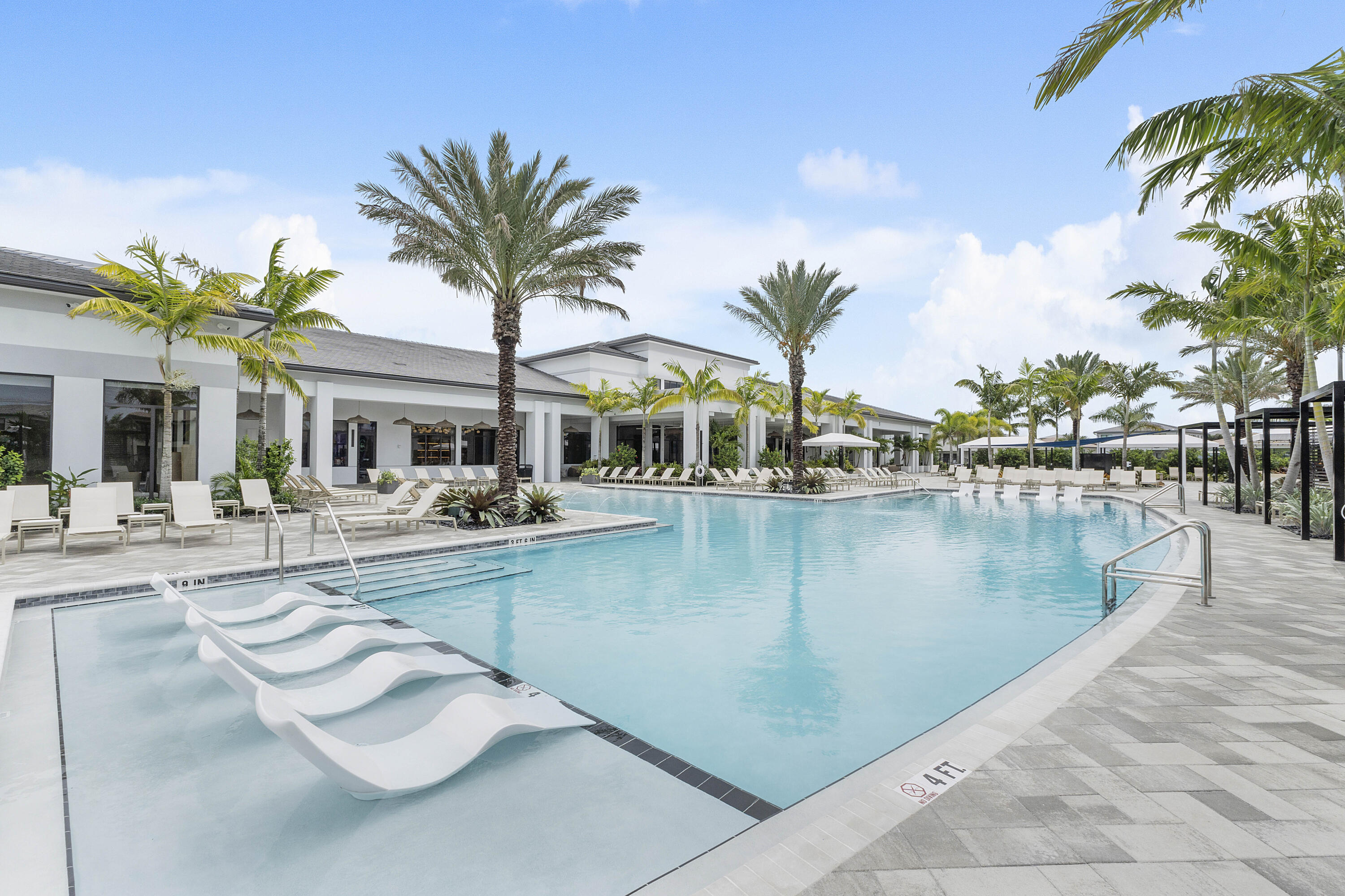9322 Sunflower Mdw Road Boca Raton, FL 33434 - Photo 73 of 87 a view of a swimming pool with chairs