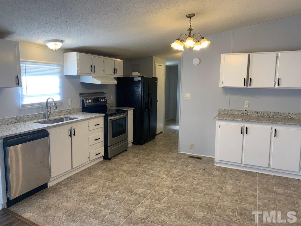 8834 South Creek Road Willow Spring, NC 27592 - Photo 9 of 20 Updated kitchen with granite and SS Appliances
