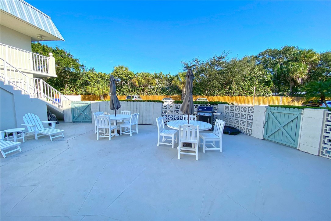 900 Jasmine Lane, Unit 9A Vero Beach, FL 32963 - Photo 12 of 26 a view of an outdoor sitting area with chairs