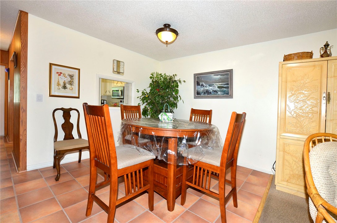 900 Jasmine Lane, Unit 9A Vero Beach, FL 32963 - Photo 4 of 26 a view of a dining room with furniture and a window
