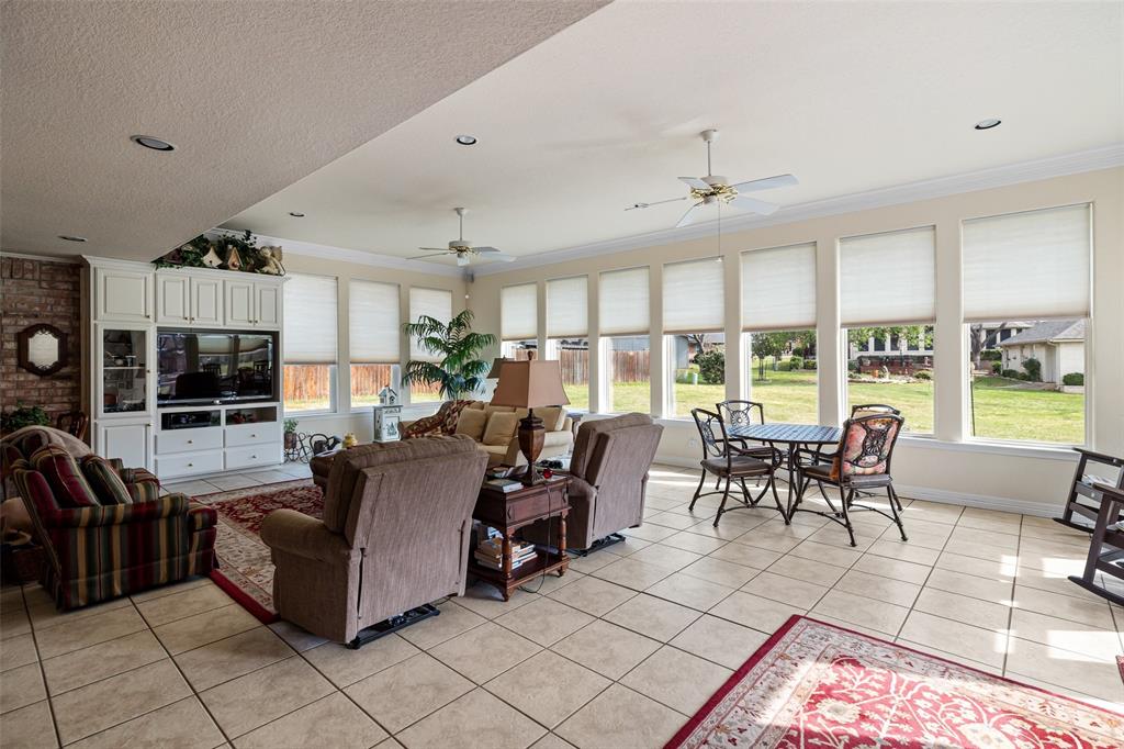8913 Brierfield Road Granbury, TX 76049 - Photo 17 of 40 a living room with furniture and a large window