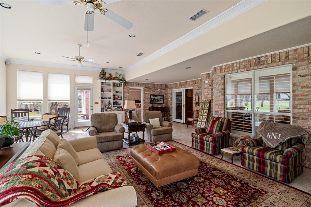 8913 Brierfield Road Granbury, TX 76049 - Photo 18 of 40 a living room with furniture and a large window