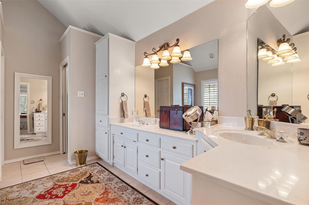 8913 Brierfield Road Granbury, TX 76049 - Photo 23 of 40 a bathroom with a double vanity sink and a mirror