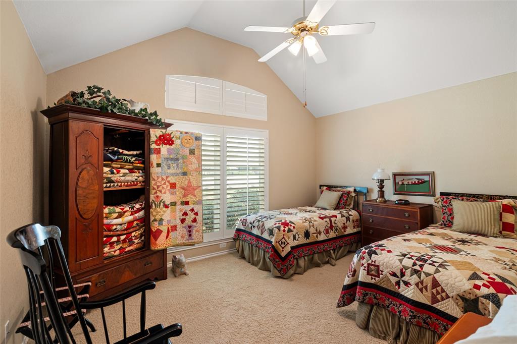 8913 Brierfield Road Granbury, TX 76049 - Photo 26 of 40 a bedroom with two beds and a window