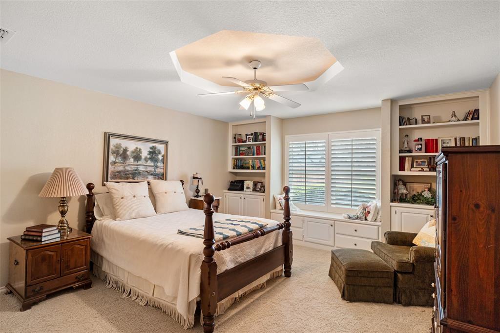 8913 Brierfield Road Granbury, TX 76049 - Photo 28 of 40 a bedroom with a bed couch and window