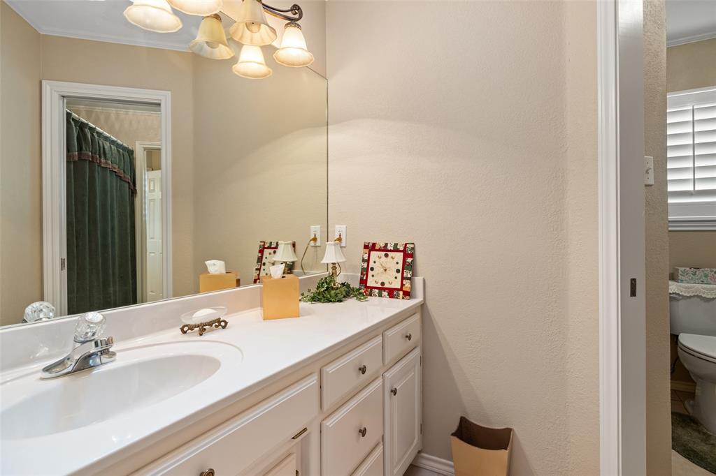 8913 Brierfield Road Granbury, TX 76049 - Photo 29 of 40 a bathroom with a double vanity sink and a mirror