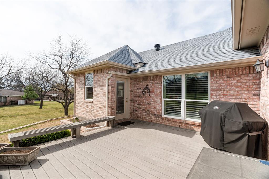 8913 Brierfield Road Granbury, TX 76049 - Photo 32 of 40 a front view of a house with garden