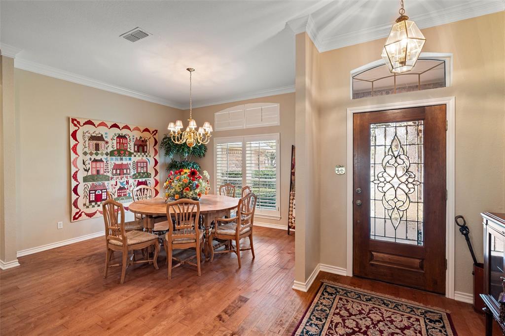 8913 Brierfield Road Granbury, TX 76049 - Photo 7 of 40 a view of a dining room with furniture window and wooden floor