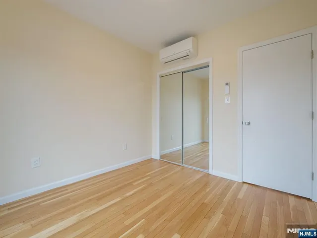 a kitchen with granite countertop a sink stove and microwave