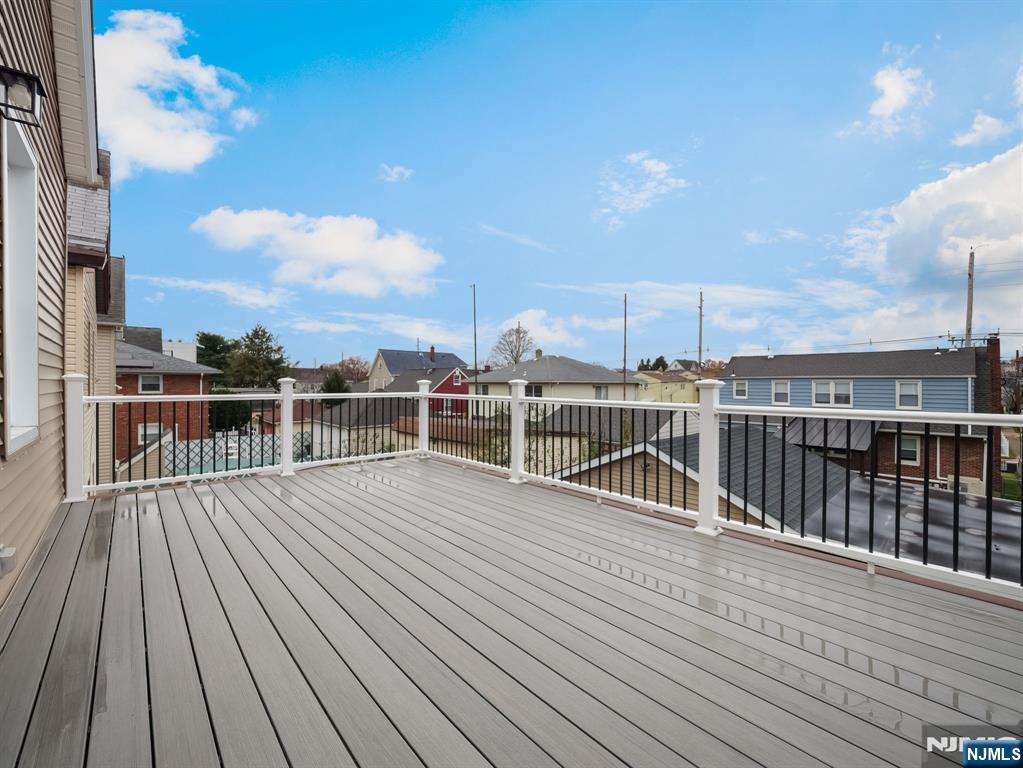 413 Lanza Avenue Garfield, NJ 07026 - Photo 16 of 37 a view of a balcony with wooden floor