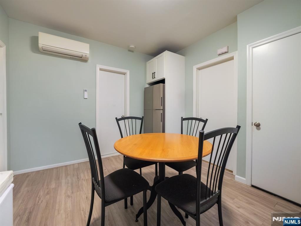 413 Lanza Avenue Garfield, NJ 07026 - Photo 19 of 37 a view of a dining room with furniture and wooden floor