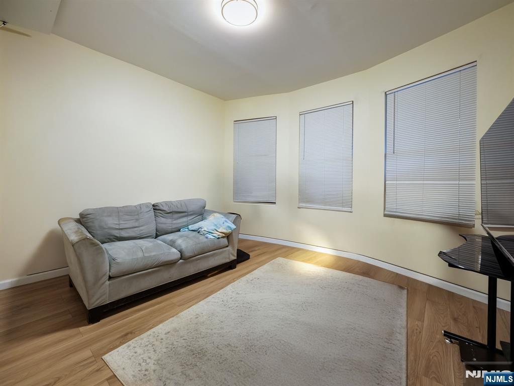 413 Lanza Avenue Garfield, NJ 07026 - Photo 21 of 37 a living room with furniture and a window