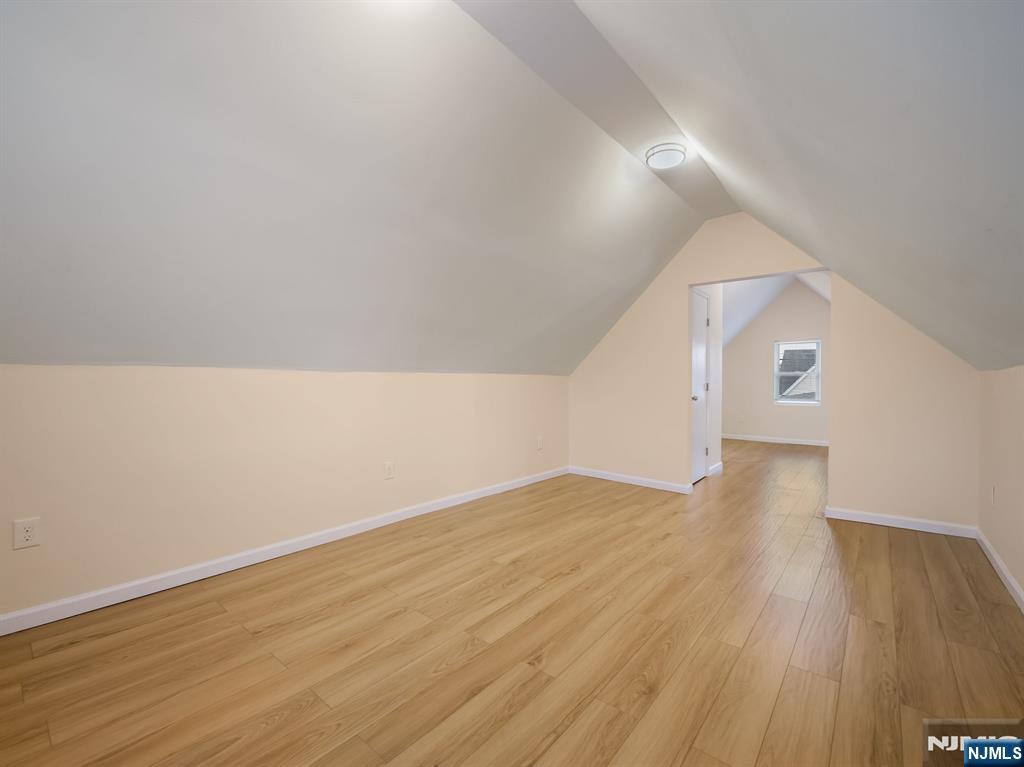 413 Lanza Avenue Garfield, NJ 07026 - Photo 5 of 37 a view of an empty room and wooden floor