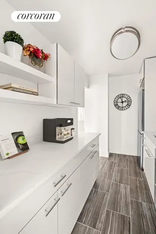 a kitchen with a refrigerator and a stove