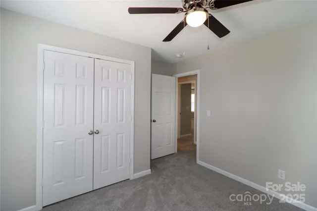 a view of a chandelier fan in a room