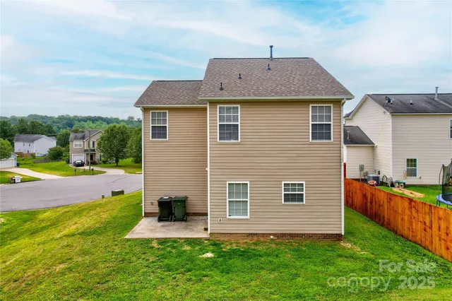 a front view of house with yard and swimming pool