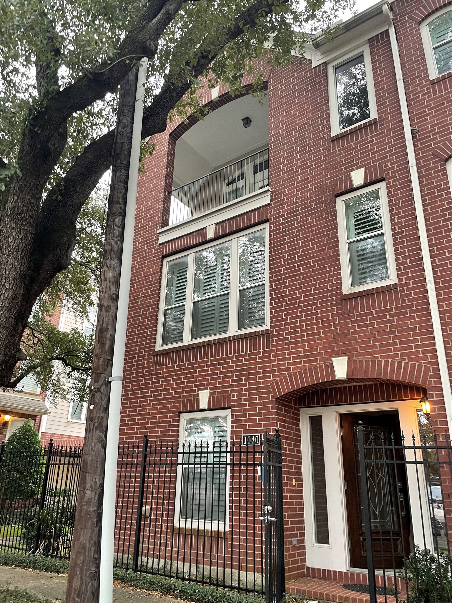 1040 La Rue Street Houston, TX 77019 - Photo 2 of 29 a front view of a house with a yard