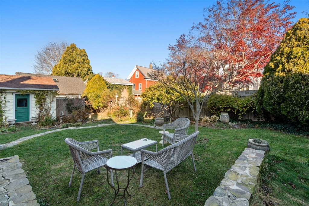 20 Haskell Street Gloucester, MA 01930 - Photo 18 of 27 a view of a chairs and table in backyard of the house