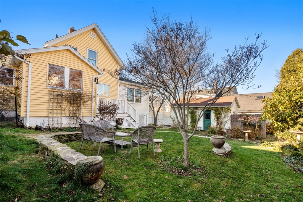 20 Haskell Street Gloucester, MA 01930 - Photo 19 of 27 a backyard of a house with table and chairs