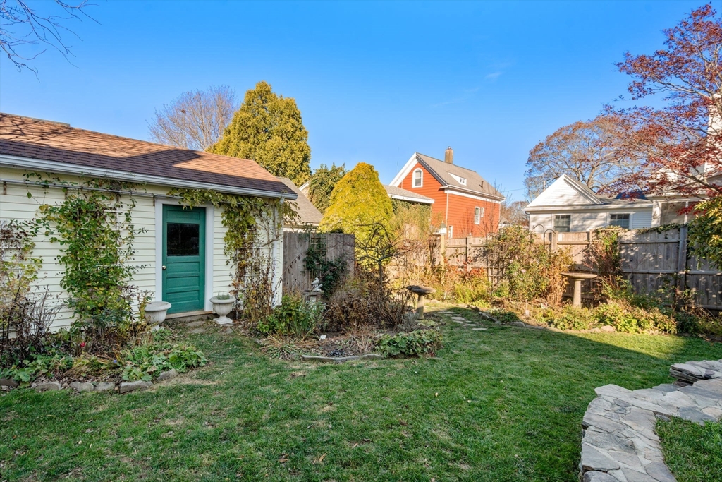 20 Haskell Street Gloucester, MA 01930 - Photo 21 of 27 a view of a house with a yard and a garden